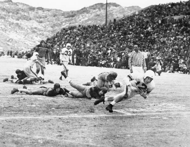  UC’s Harold Johnson scores in the third quarter [AP Photo] 