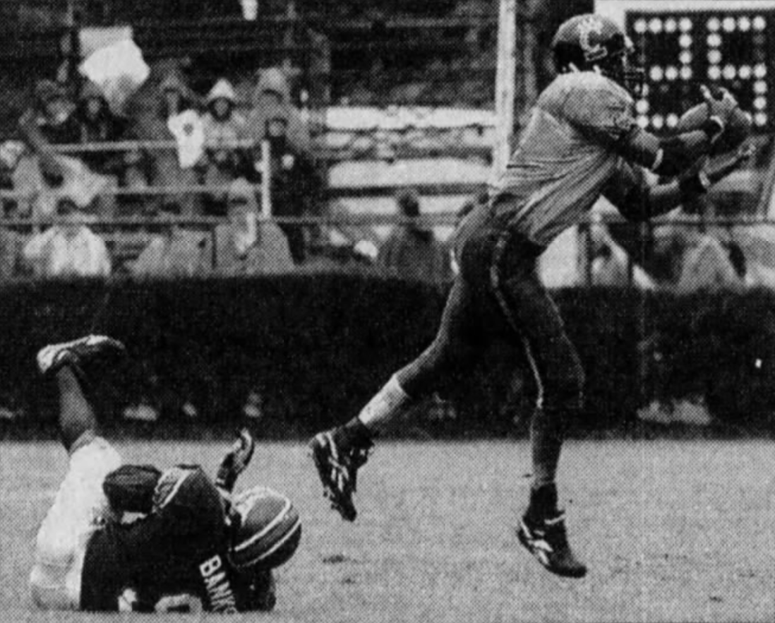  UC’s Robert Tate beats VT’s Antonio Banks. [AP photo via Cincinnati Enquirer] 